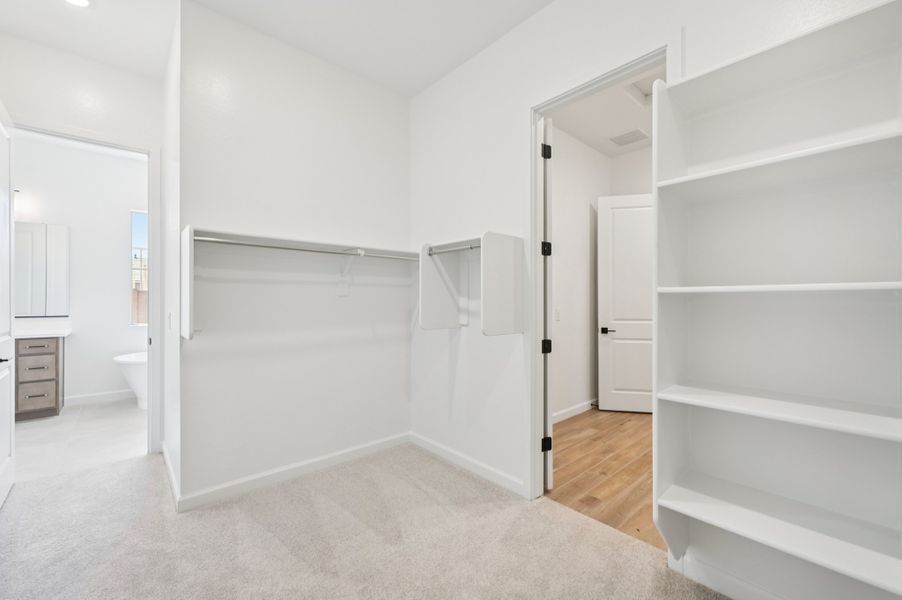 Primary walk in closet. Finishes and options may vary by community. Primary walk in closet. Finishes and options may vary by community.