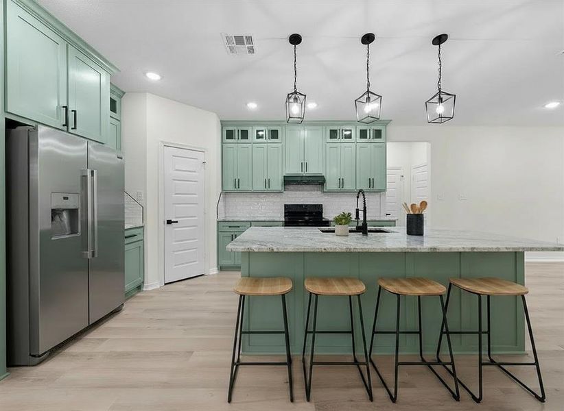 Virtually Staged Kitchen featuring green cabinetry, stainless steel fridge with ice dispenser, a breakfast bar area, and light wood-style flooring