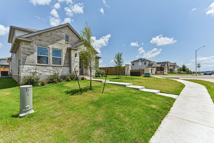 Front exterior of a new home in Stonewall Ranch, Liberty Hill, TX, highlighting curb appeal (Image 23).
