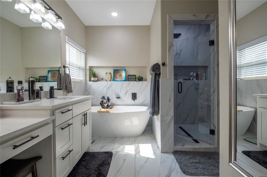 primary bathroom with stand alone tub