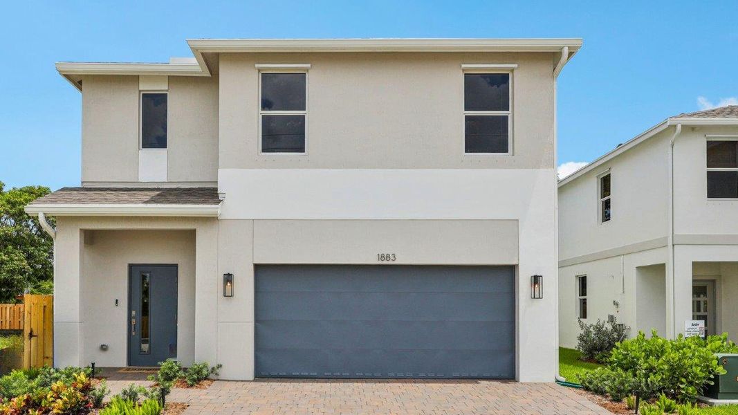 Representative exterior photo of a completed home built from the Robie by D.R. Horton in Hunters Manor, Pompano Beach, FL (Image 1). Representative exterior photo of a completed home built from the Robie by D.R. Horton in Hunters Manor, Pompano Beach, FL (Image 1).
