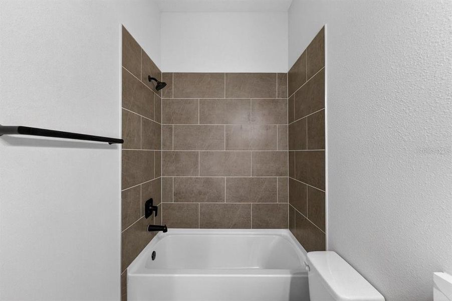 Furnished interior view inside a new home in Stables at Cary Forest, Bryceville (Image 9).