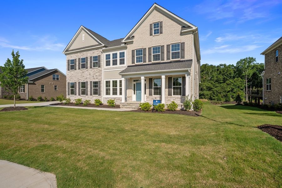 Front exterior of a new home in Walnut Grove, Easley, SC, highlighting curb appeal (Image 27). Front exterior of a new home in Walnut Grove, Easley, SC, highlighting curb appeal (Image 27).