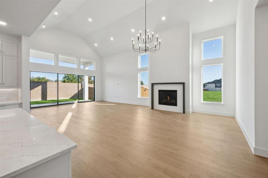 Featuring beautiful flooring, elegant chandelier and luxurious fireplace, this dining room is the perfect place to host all your holiday gatherings!