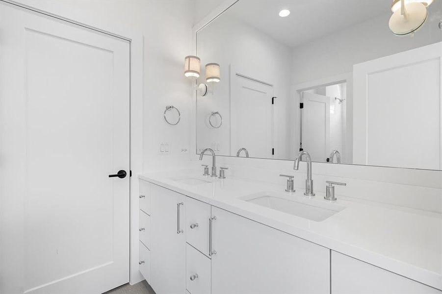Full bath featuring double vanity and recessed lighting Full bath featuring double vanity and recessed lighting