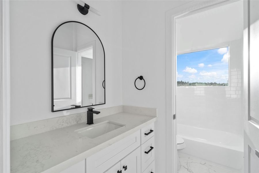 With a window right in the shower, you’ll never miss a ray of natural light—or your chance to sing to the neighbors while you belt out your favorite tunes. With a window right in the shower, you’ll never miss a ray of natural light—or your chance to sing to the neighbors while you belt out your favorite tunes.