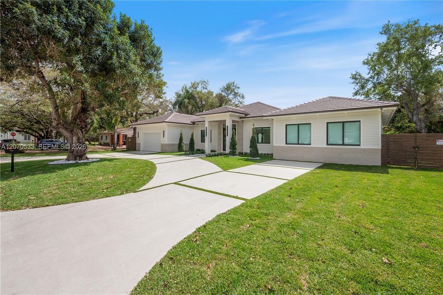 Front exterior of a new home in , Miami, FL, highlighting curb appeal (Image 1). Front exterior of a new home in , Miami, FL, highlighting curb appeal (Image 1).