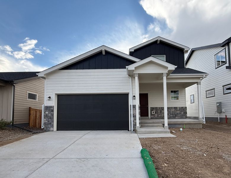 Front exterior of a new home in Granary, Johnstown, CO, highlighting curb appeal (Image 27).