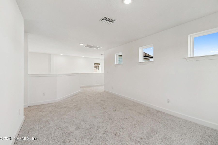 Spacious, unfurnished interior of a new home in Evergreen Island at Silverleaf - Classic, St. Augustine (Image 23).