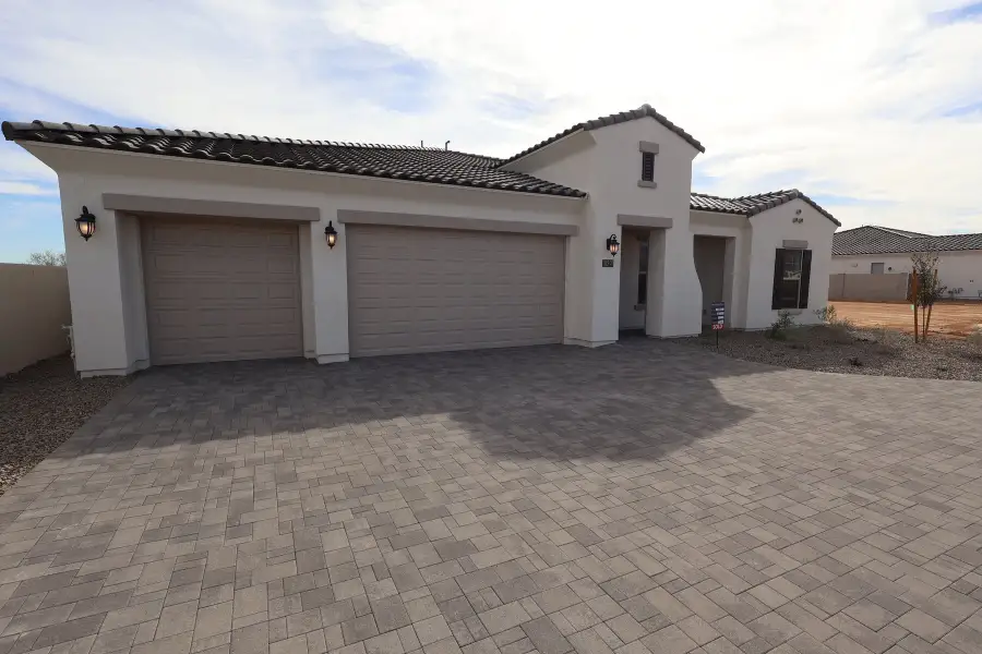 Front exterior of a new home in Sentiero at Windrose, Waddell, AZ, highlighting curb appeal (Image 2).
