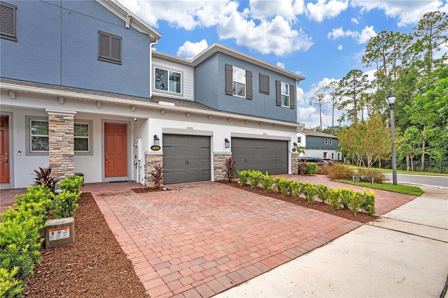 Front exterior of a new home in , Oviedo, FL, highlighting curb appeal (Image 25).