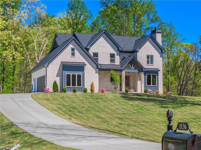 Front exterior of a new home in , Hoschton, GA, highlighting curb appeal (Image 28).