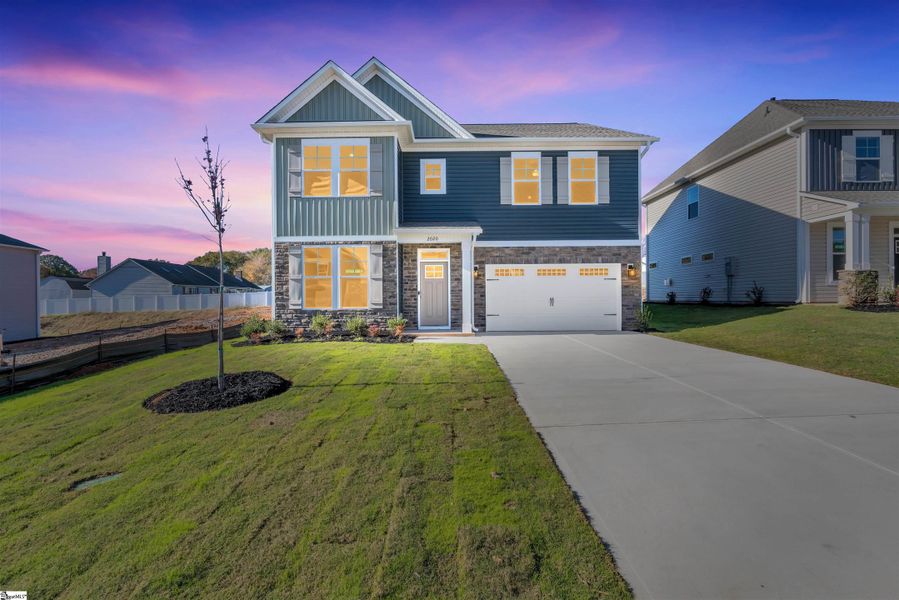 Front exterior of a new home in Halton Oaks, Spartanburg, SC, highlighting curb appeal (Image 19).