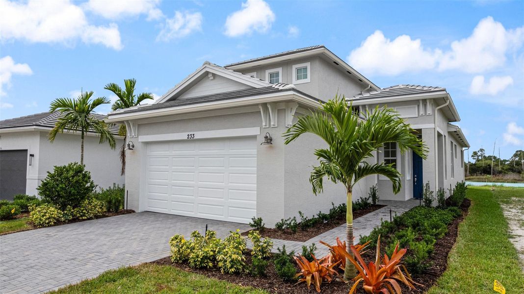 Front exterior of a new home in , Port St. Lucie, FL, highlighting curb appeal (Image 1). Front exterior of a new home in , Port St. Lucie, FL, highlighting curb appeal (Image 1).