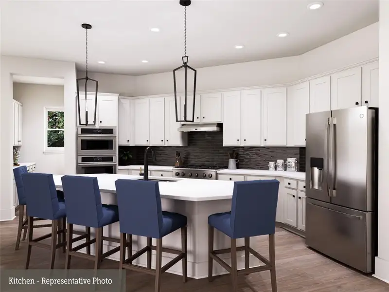 REPRESENTATIVE PHOTO:  Beautiful Kitchen with large island/breakfast bar, gas cooktop, updraft vent hood and Butlers pantry with walk in pantry