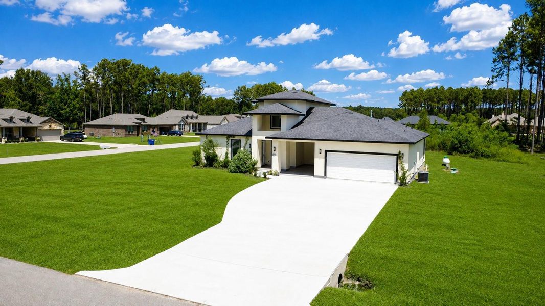 Front exterior of a new home in , Dayton, TX, highlighting curb appeal (Image 24). Front exterior of a new home in , Dayton, TX, highlighting curb appeal (Image 24).