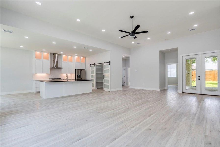 Spacious living room with open view of kitchen