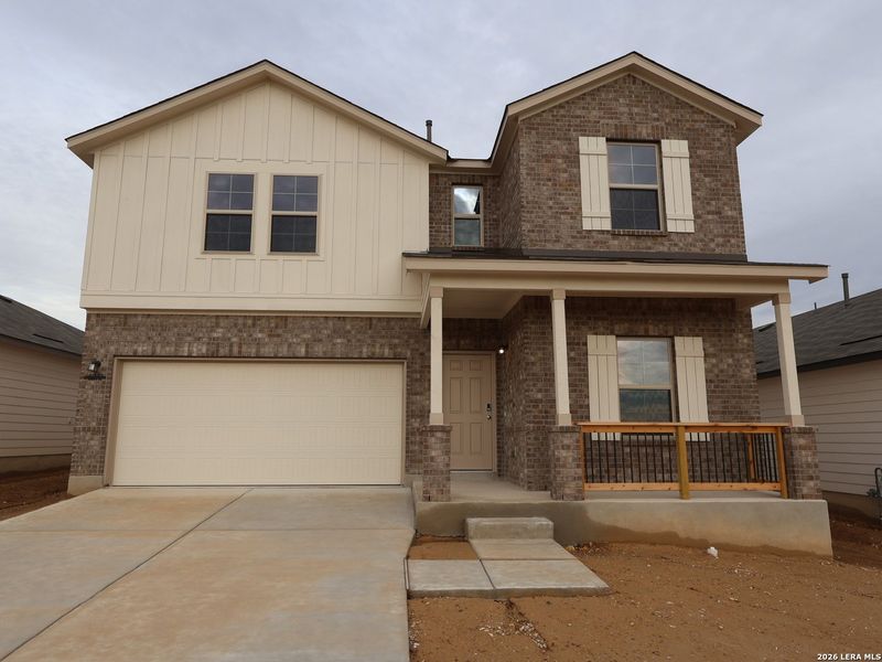 Front exterior of a new home in Mesquite Ridge, San Antonio, TX, highlighting curb appeal (Image 2). Front exterior of a new home in Mesquite Ridge, San Antonio, TX, highlighting curb appeal (Image 2).