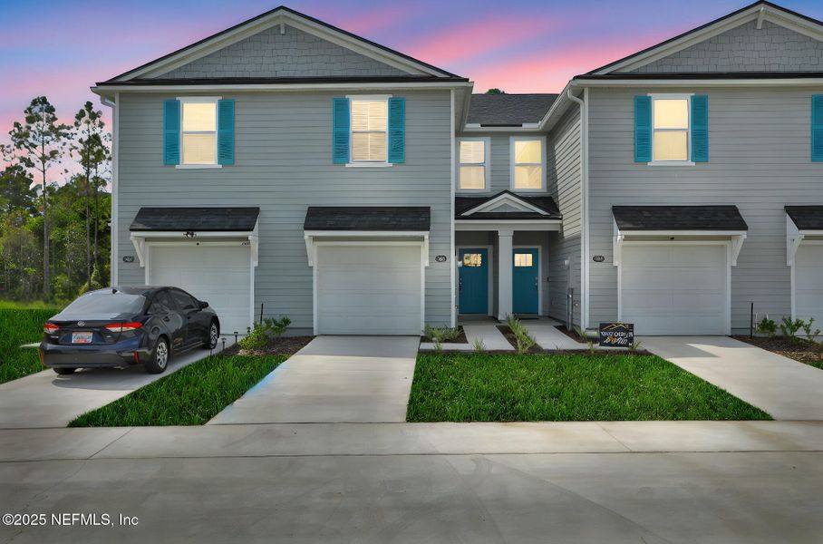 Front exterior of a new home in Atlantis Pointe, Middleburg, FL, highlighting curb appeal (Image 22).