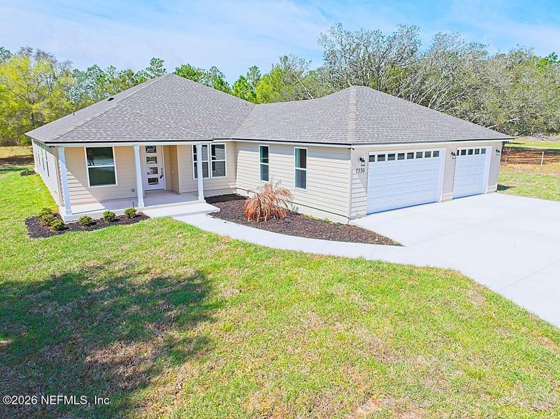 Front exterior of a new home in , Keystone Heights, FL, highlighting curb appeal (Image 1). Front exterior of a new home in , Keystone Heights, FL, highlighting curb appeal (Image 1).