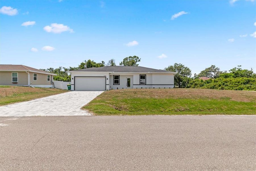 Front exterior of a new home in , Port Charlotte, FL, highlighting curb appeal (Image 16). Front exterior of a new home in , Port Charlotte, FL, highlighting curb appeal (Image 16).