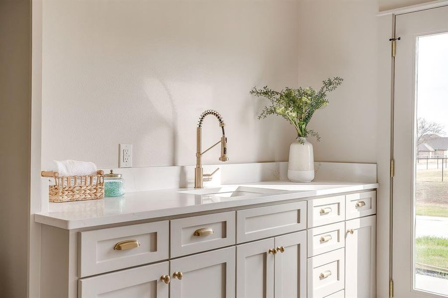 utility room with soaking sink and quartz countertops utility room with soaking sink and quartz countertops