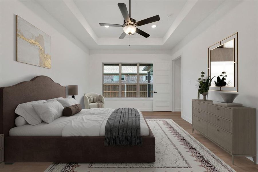 Bedroom featuring light wood-style flooring, a ceiling fan, and recessed lighting