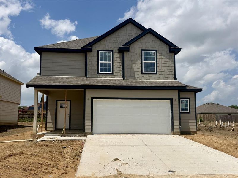 Front exterior of a new home in Hanna Ranch, Everman, TX, highlighting curb appeal (Image 1). Front exterior of a new home in Hanna Ranch, Everman, TX, highlighting curb appeal (Image 1).