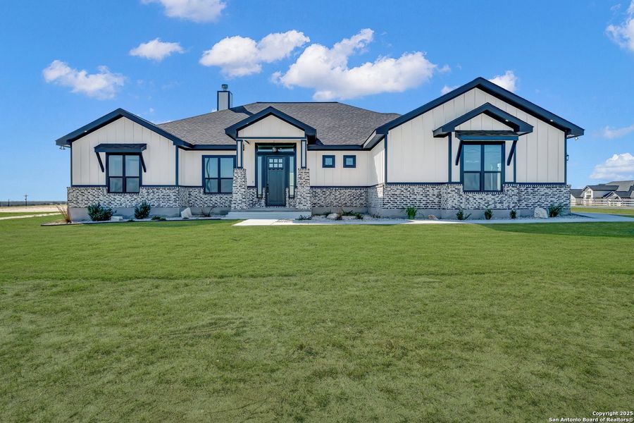 Front exterior of a new home in , La Vernia, TX, highlighting curb appeal (Image 28).
