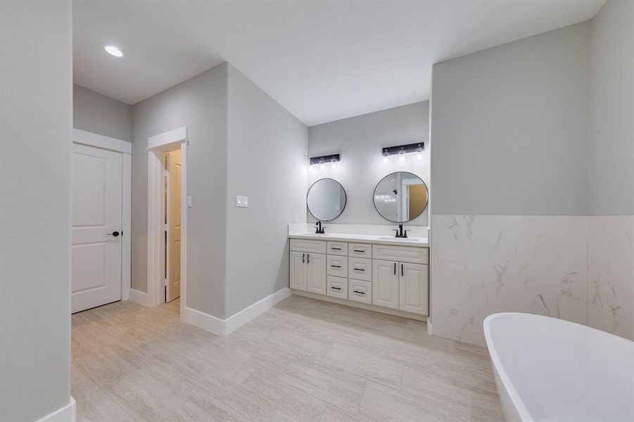 Primary bath with a private toilet area, ensuring added privacy and convenience for a comfortable experience.