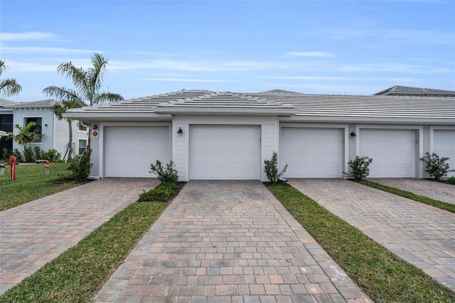 Front exterior of a new home in , Punta Gorda, FL, highlighting curb appeal (Image 19).