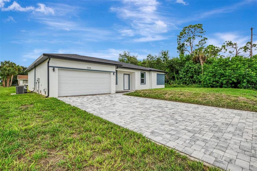 Front exterior of a new home in , Port Charlotte, FL, highlighting curb appeal (Image 25).