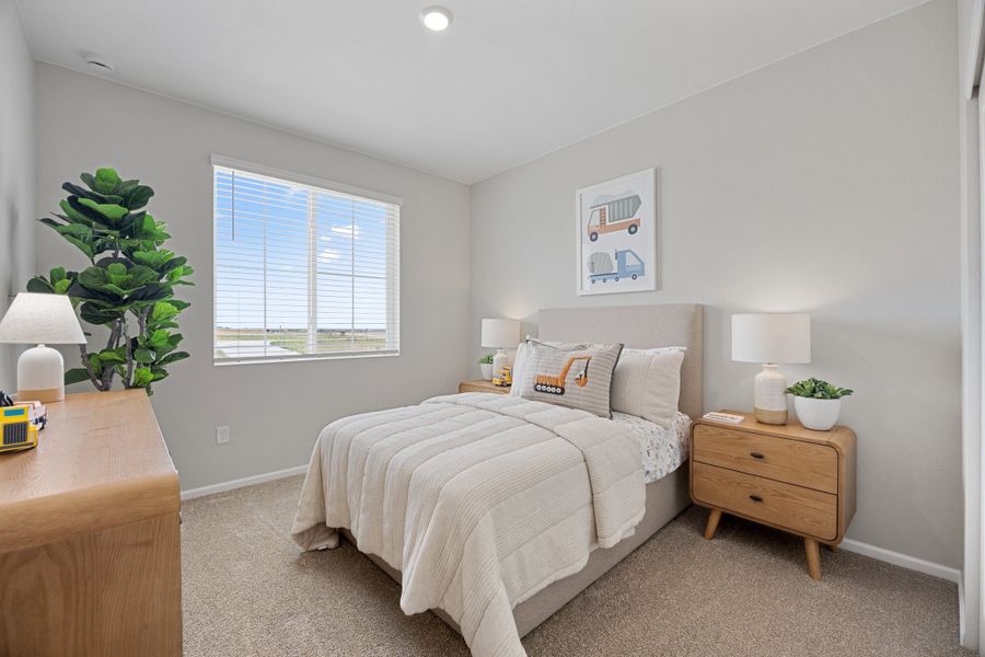 Representative furnished interior of a home built from the 2504 by Risewell Homes in Harvest Crossing, Aurora (Image 26).