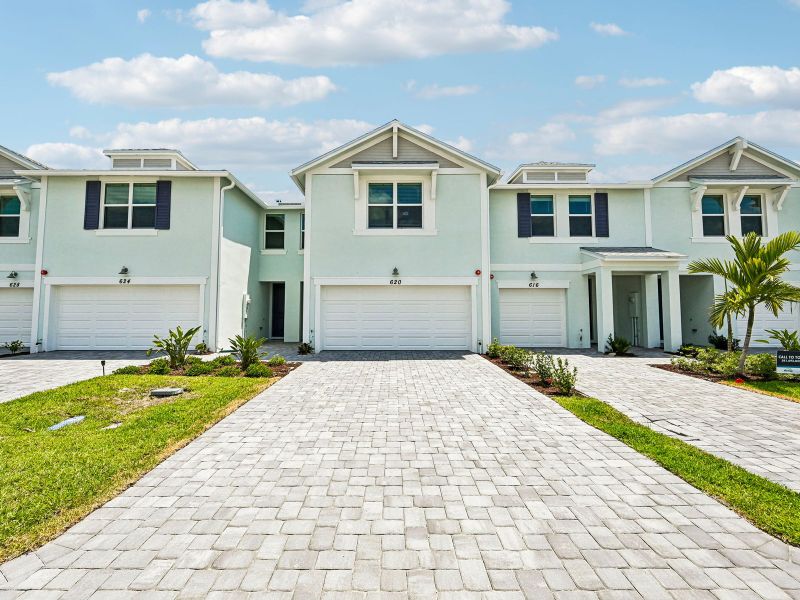 Front exterior of a new home in Tidewater, Fort Pierce, FL, highlighting curb appeal (Image 17).