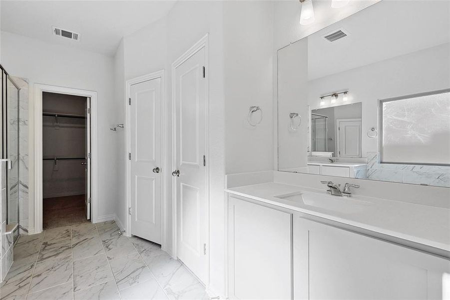 Bathroom with tile flooring and oversized vanity