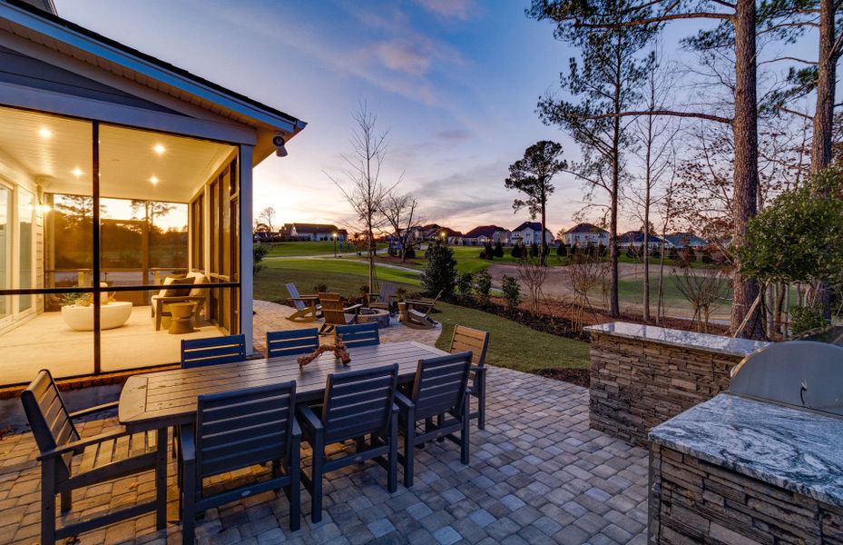 Spacious screened in porch and fire pit on the patio to gather and relax with friends