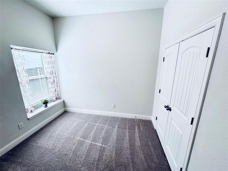 Unfurnished bedroom with carpet floors and a closet