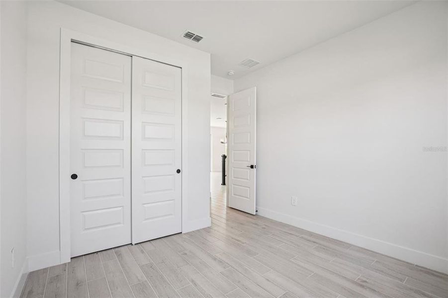 Spacious, unfurnished interior of a new home in Magnolia Bay - Reserve Series, Nokomis (Image 18).