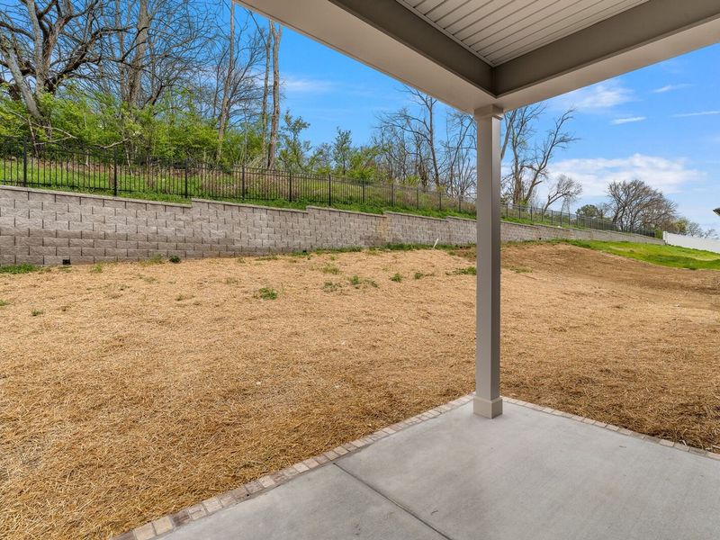 Exterior details and patio area of a home in Woods Crossing, Gallatin (Image 29).