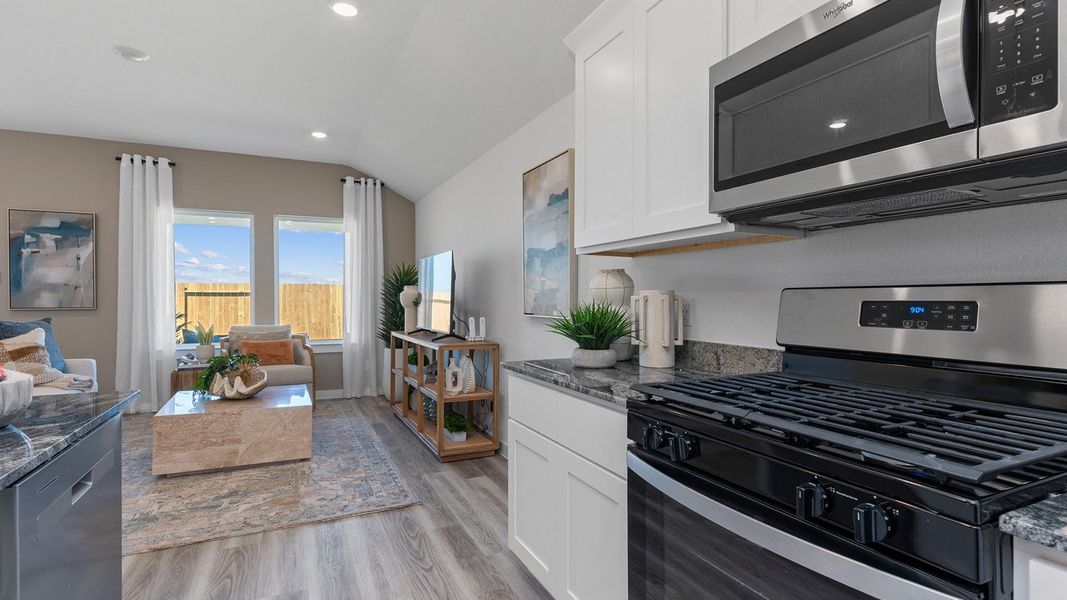 Furnished interior view inside a new home in Caldwell Crossing, Iowa Colony (Image 4).