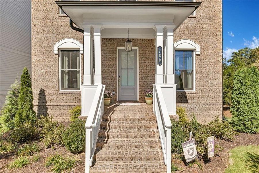 Exterior details and patio area of a home in Manning on the Square, Alpharetta (Image 4).