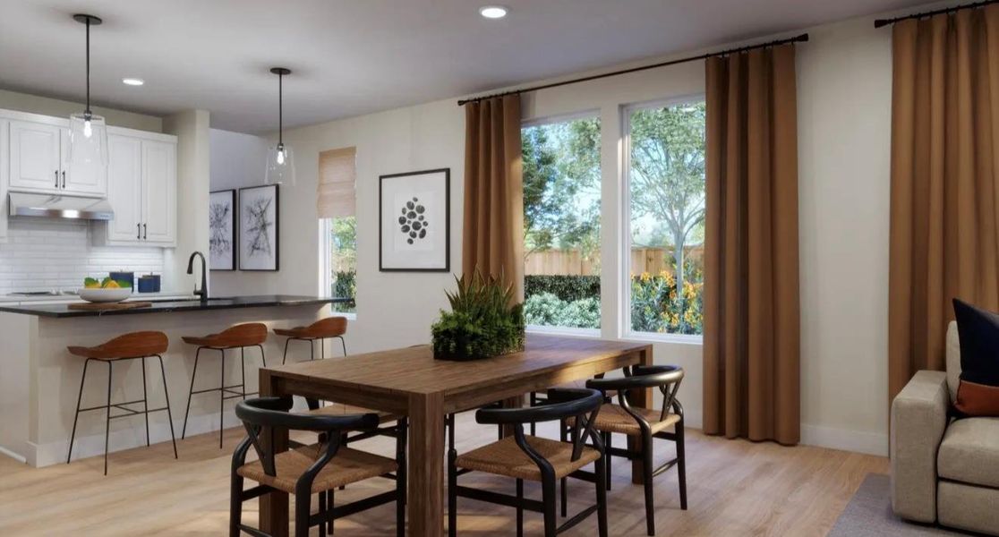 Dining space featuring light wood-style flooring and recessed lighting