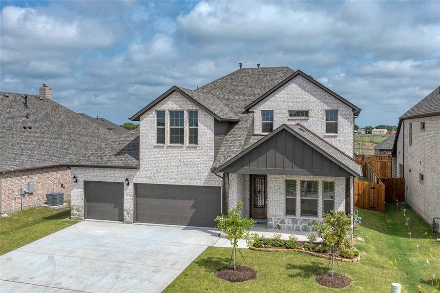 Front exterior of a new home in Stone River Glen, Royse City, TX, highlighting curb appeal (Image 2). Front exterior of a new home in Stone River Glen, Royse City, TX, highlighting curb appeal (Image 2).