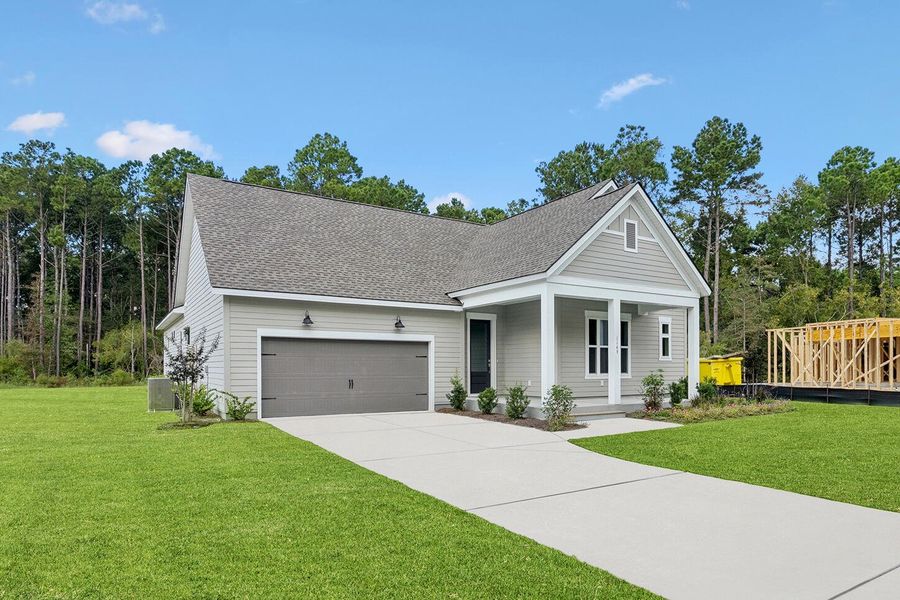 Front exterior of a new home in Hidden Ponds Reserve, Awendaw, SC, highlighting curb appeal (Image 27). Front exterior of a new home in Hidden Ponds Reserve, Awendaw, SC, highlighting curb appeal (Image 27).