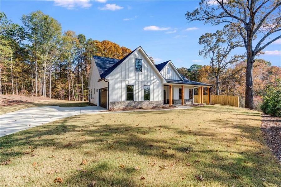 Front exterior of a new home in , Dallas, GA, highlighting curb appeal (Image 2).