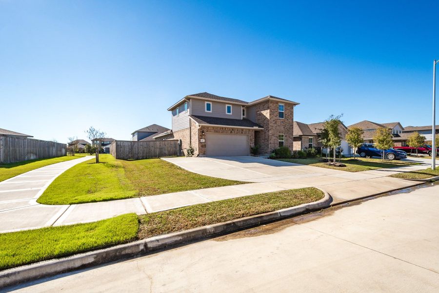 Front exterior of a new home in Heights of Barbers Hill, Baytown, TX, highlighting curb appeal (Image 26).