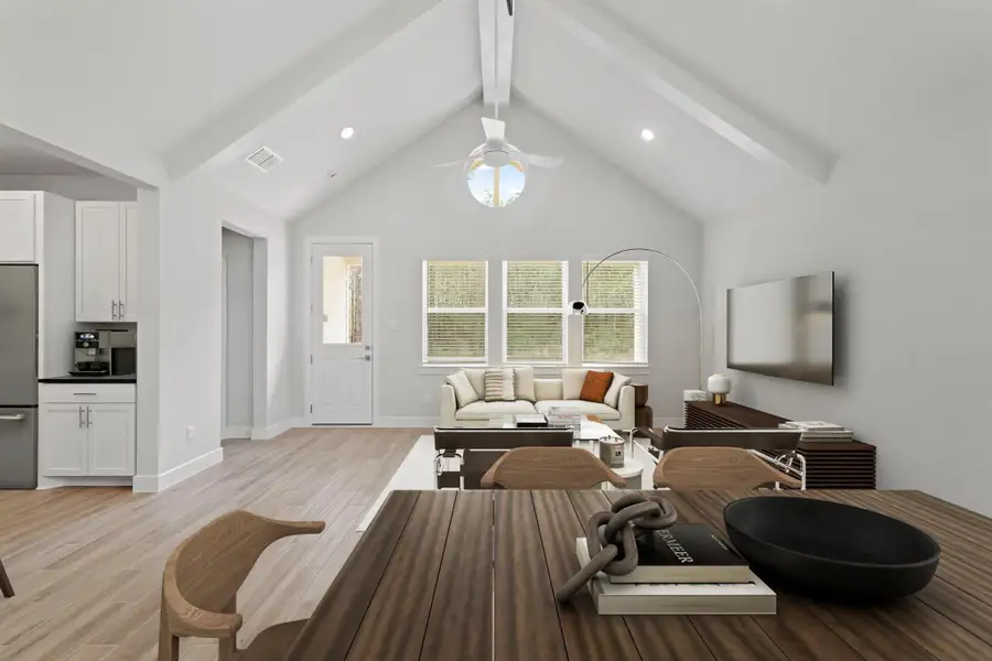 Vaulted ceilings with painted beams in the great room and dining area (*Photo not of actual home and used for illustration purposes only.)