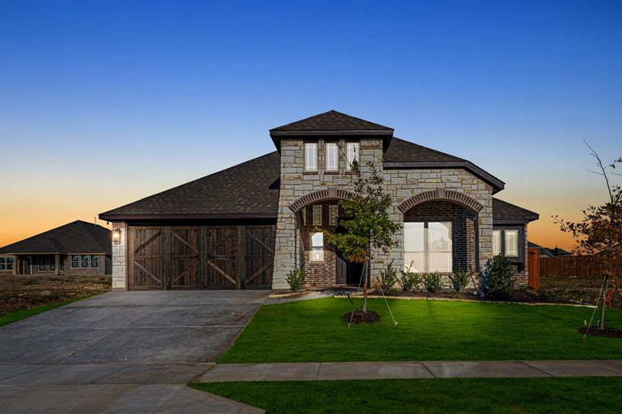 Front exterior of a new home in Star Ranch Classic 50, Godley, TX, highlighting curb appeal (Image 2). Front exterior of a new home in Star Ranch Classic 50, Godley, TX, highlighting curb appeal (Image 2).