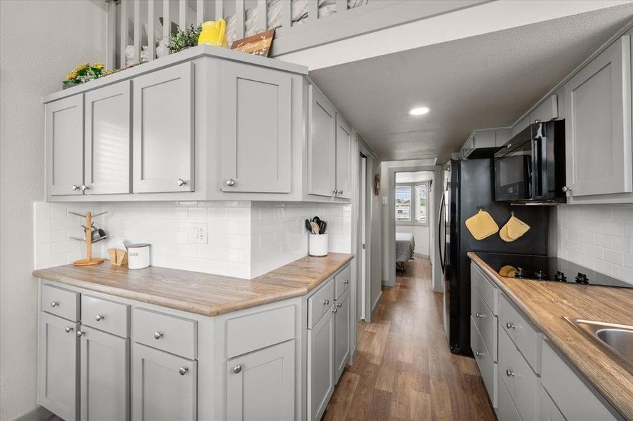 And you'll love the convenience of a full size fridge, glass top cook surface and the built in microwave.