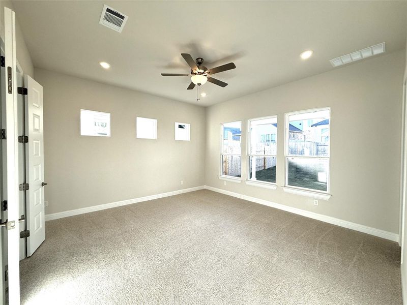 Spare room featuring light carpet, recessed lighting, and ceiling fan